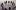 A group of people stood on a stage in a circle
