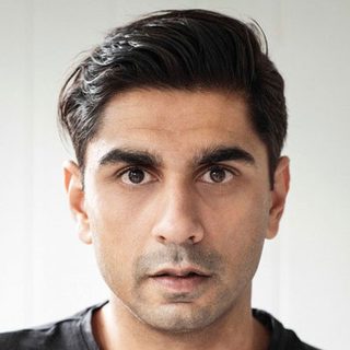 This is a headshot of Dharmesh Patel looking directly into camera.